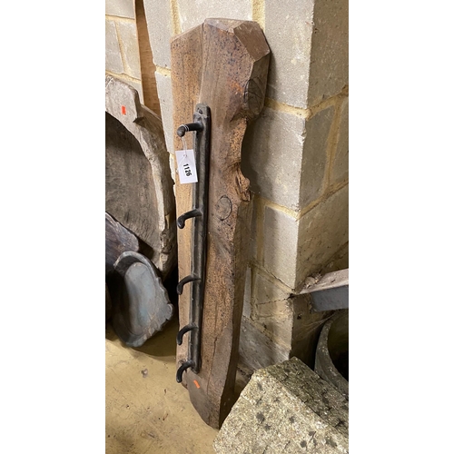 1126 - A provincial wrought iron and wood coat rack, width 107cm