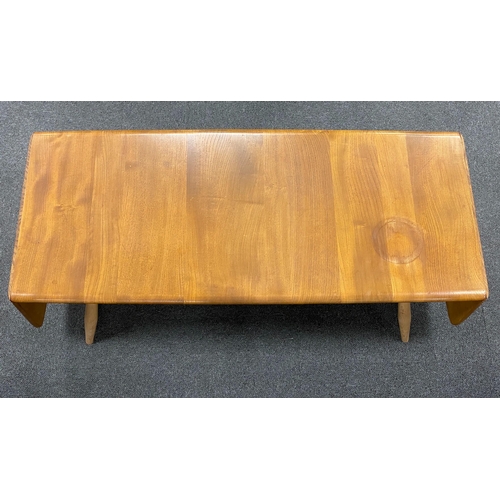 1153 - An Ercol elm drop flap coffee table, length 106cm, depth 45cm, height 36cm