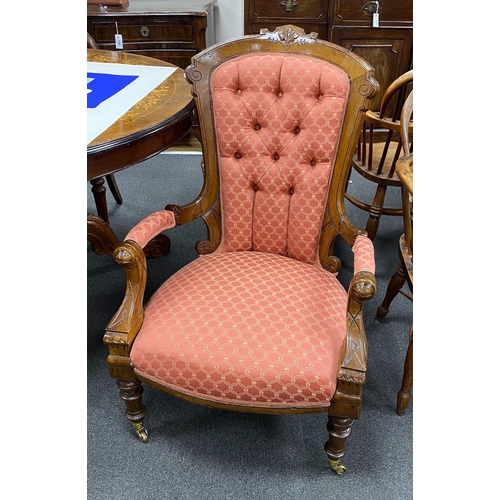 1157 - A pair of late Victorian walnut spoon back upholstered chairs, one with arms