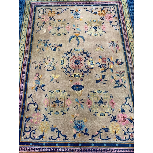 1161 - An early 20th century Chinese lilac ground carpet, 330 x 240cm