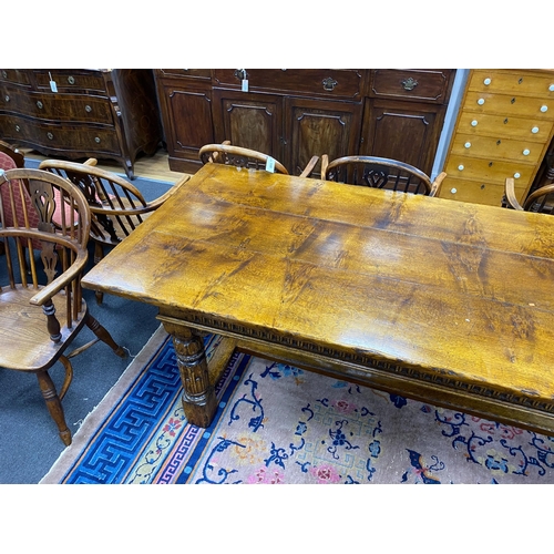 1163 - An 18th century style rectangular pale oak refectory dining table with central stretcher and two det... 