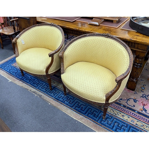 1168 - A pair of Louis XVI style carved beech upholstered tub framed chairs, width 82cm, depth 50cm, height... 