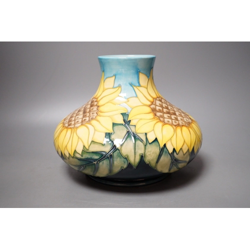 1282 - A Moorcroft pottery vase of compressed form, decorated in the "Sunflower" pattern, 20cm... 