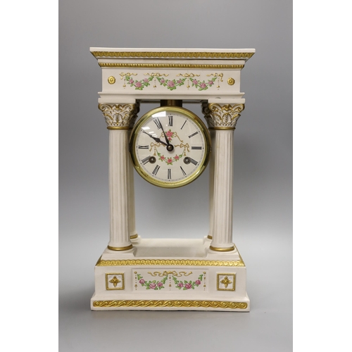 1293 - A modern ceramic portico column clock with floral and gilt decoration, with key and pendulum, 37cm t... 