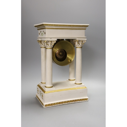 1293 - A modern ceramic portico column clock with floral and gilt decoration, with key and pendulum, 37cm t... 