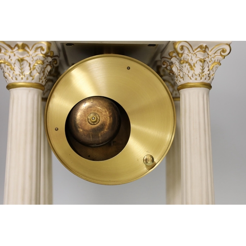 1293 - A modern ceramic portico column clock with floral and gilt decoration, with key and pendulum, 37cm t... 