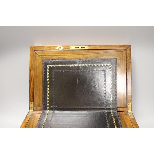 1306 - A small early 20th century brass bound mahogany writing slope, 35cm