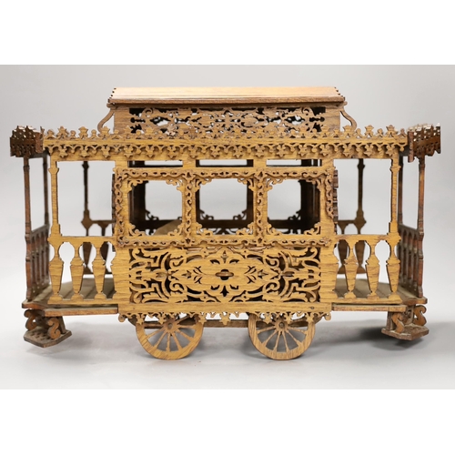 1308 - An early 20th century fretwork model of an American street car, 45cm