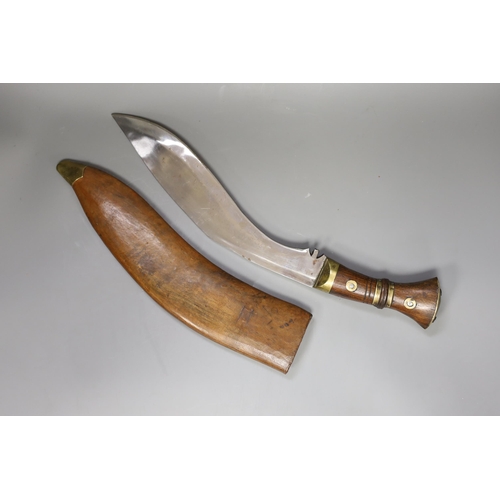 1364 - A large Kukri in with brass mounted wooden handle and leather wooden case, 54cm long