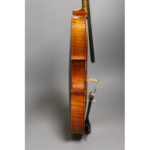 1379 - A cased child's violin and bow with ivorine tip,  violin 55cms long,