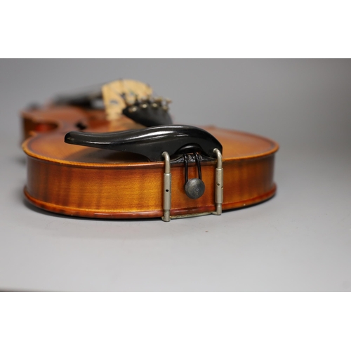 1379 - A cased child's violin and bow with ivorine tip,  violin 55cms long,