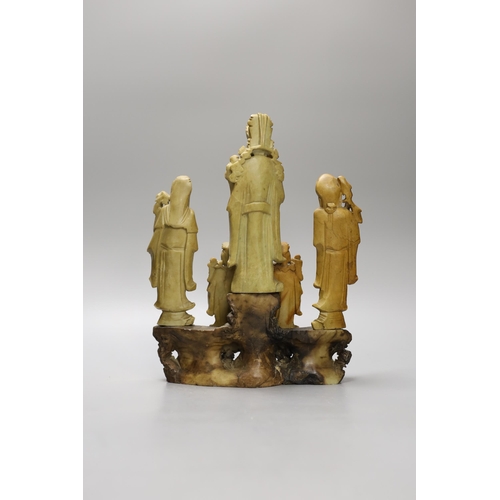 1398 - A Chinese soapstone five immortals group on graduated base, 28cm tall