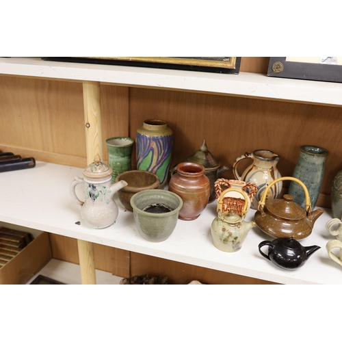 1402 - A large quantity of British studio pottery teapots, mugs, jugs and other miscellaneous items, to inc... 