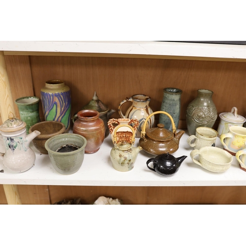 1402 - A large quantity of British studio pottery teapots, mugs, jugs and other miscellaneous items, to inc... 