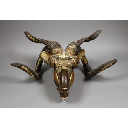 1430 - A Buddhist decorated ram's skull with brass decor, 20cm tall