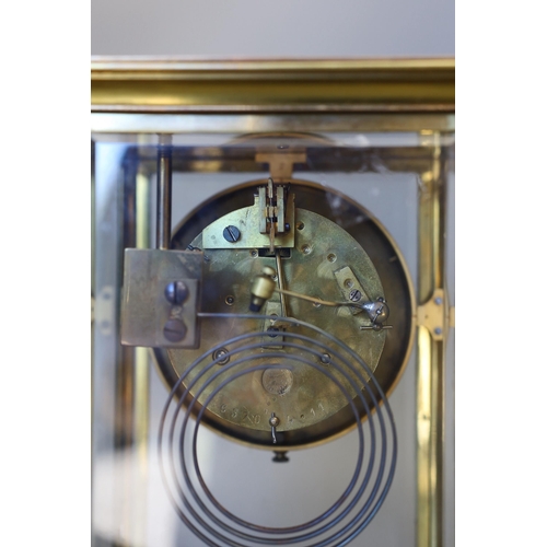 1458 - A 19th century French four glass mantel clock, with key and pendulum, 27cms high