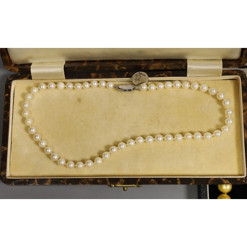 1914 - Four assorted cased single strand cultured pearl necklaces, with yellow metal or sterling clasps, lo... 