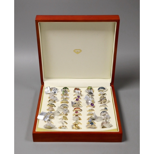 1915 - Fifty assorted modern gem set dress rings, to include thirty six 9ct gold rings including diamond se... 