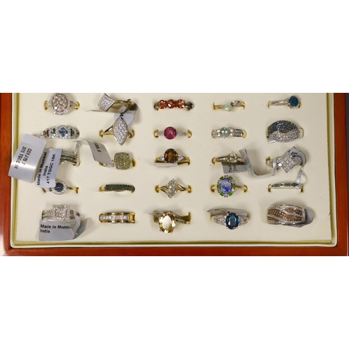 1915 - Fifty assorted modern gem set dress rings, to include thirty six 9ct gold rings including diamond se... 