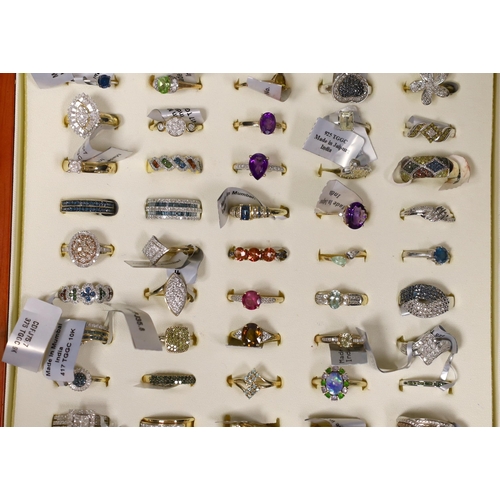 1915 - Fifty assorted modern gem set dress rings, to include thirty six 9ct gold rings including diamond se... 