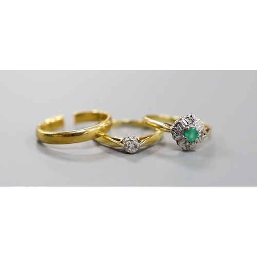 1917 - A 22ct yellow gold wedding band (cut), 3.5 grams together with two 18ct gold rings, emerald and illu... 