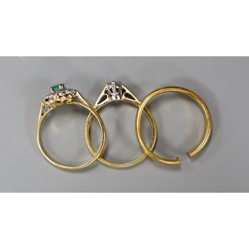 1917 - A 22ct yellow gold wedding band (cut), 3.5 grams together with two 18ct gold rings, emerald and illu... 