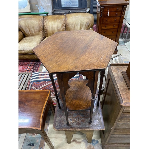 1038 - A Liberty style octagonal oak centre table, width 45cm, height 70cm together with a Moorish pokerwor... 