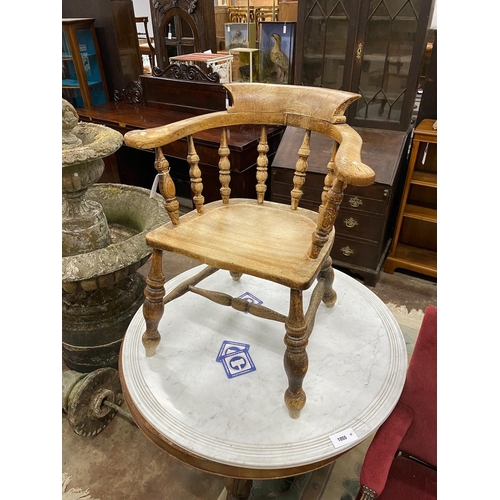 1054 - A Victorian elm and beech sun bleached smoker's bow chair, width 66cm, depth 43cm, height 78cm... 
