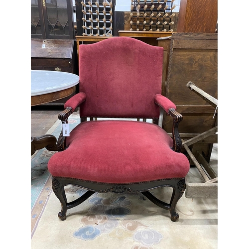 1056 - A 19th century French upholstered oak open armchair, width 72cm, depth 58cm, height 93cm