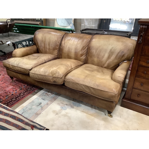 1077 - A Howard style pale brown leather three seater settee, length 200cm, width 110cm, height 80cm