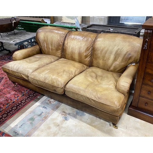 1077 - A Howard style pale brown leather three seater settee, length 200cm, width 110cm, height 80cm
