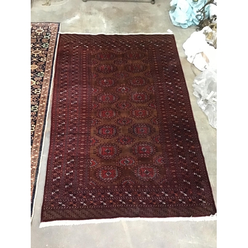1086 - A Bokhara red ground carpet, 230cm x 152cm