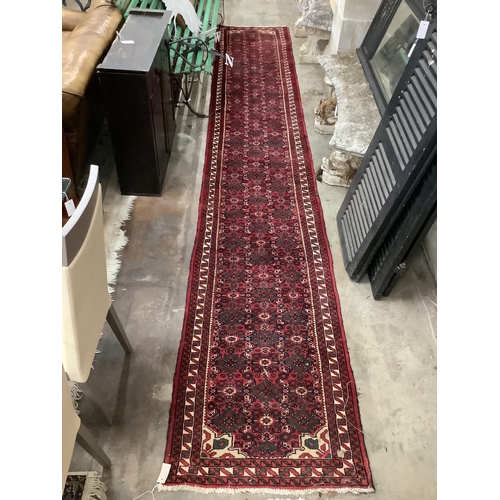 1096 - A North West Persian red ground runner, 480 x 80cm