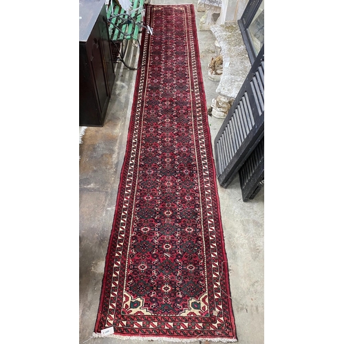 1096 - A North West Persian red ground runner, 480 x 80cm