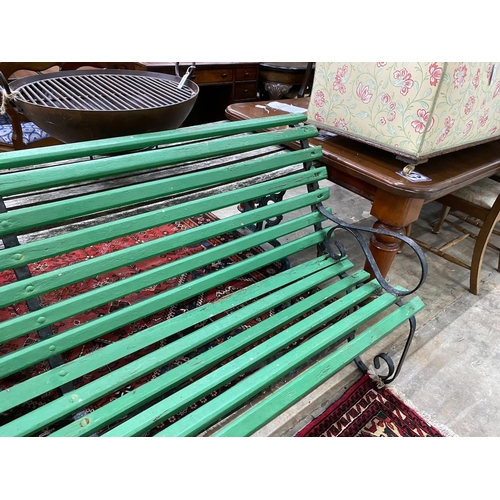 1100 - A wrought iron painted slatted wood garden bench, length 213cm, width 70cm, height 86cm
