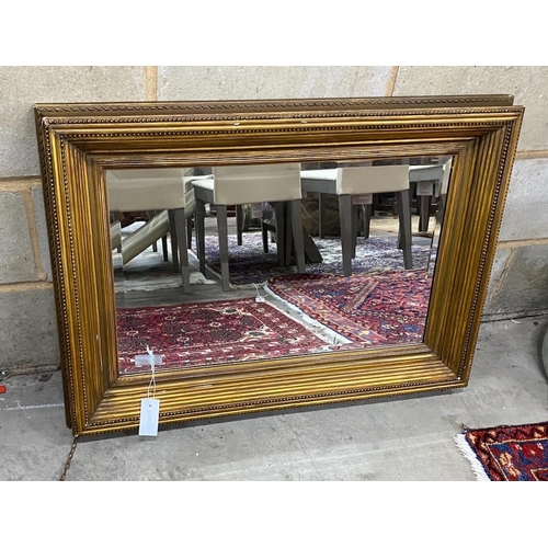 1103 - A rectangular gilt gesso wall mirror, width 88cm, height 63cm