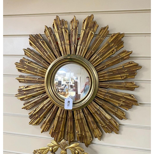 1138 - A gilt wood sunburst convex wall mirror, 64cm