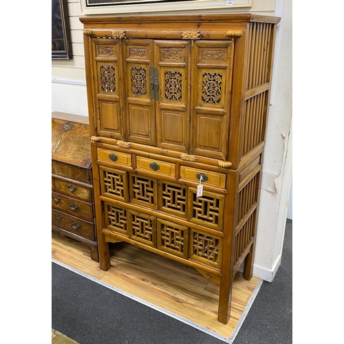 1140 - A 19th-century Chinese cypress wood side cabinet, width 106cm, depth 51cm, height 177cm