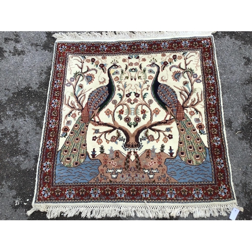 1169 - A Tabriz ivory ground 'Peacock' rug, 122 x 120cm