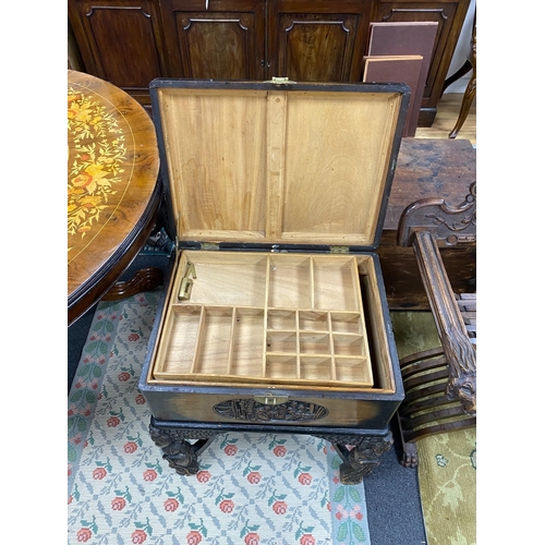 1172 - A Chinese carved camphorwood work box, width 60cm, depth 46cm, height 67cm