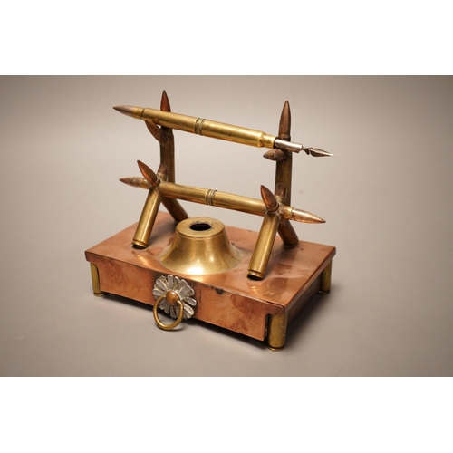 1253 - A copper and brass Trench art desk stand, 16cm wide