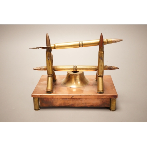 1253 - A copper and brass Trench art desk stand, 16cm wide