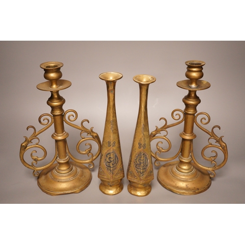 1266 - A pair of Victorian brass candlesticks and a pair of Arabic brass posy vases, tallest 25cm