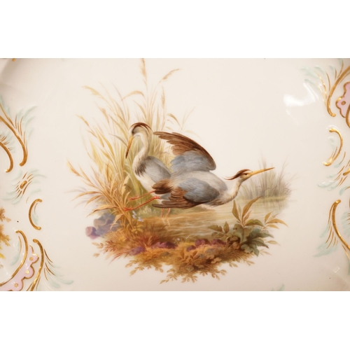 1275 - A late 19th century Meissen porcelain plate, painted with herons and game birds amid grass, diameter... 