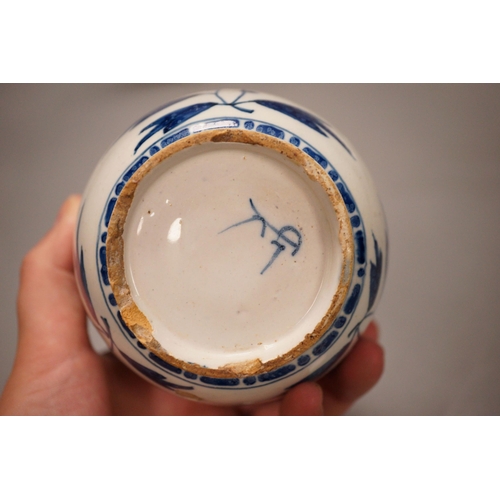 1289 - Two 18th century English delftware plates and a 18th century Delft vase, plate diameter 23cm (3)... 