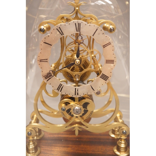 1291 - A 19th-century brass single fusee skeleton timepiece under dome, with wall bracket