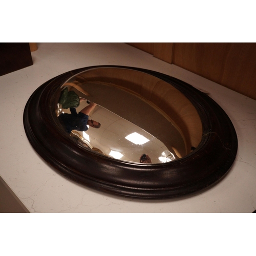 1292 - An unusual 19th century oval framed convex wall mirror, 44x54cm including frame