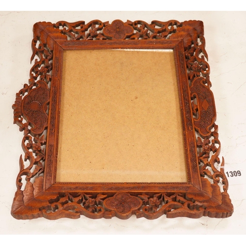 1309 - A Chinese carved sandalwood picture frame, 36x41 cm total