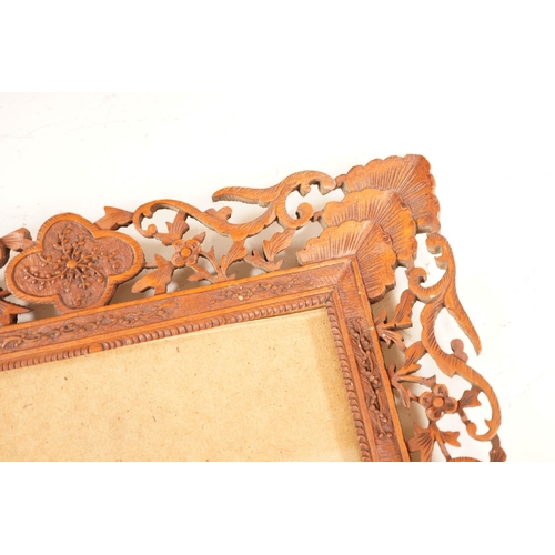 1309 - A Chinese carved sandalwood picture frame, 36x41 cm total