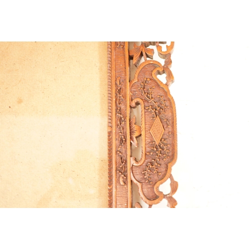 1309 - A Chinese carved sandalwood picture frame, 36x41 cm total